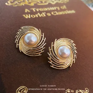 Vintage irregular gold spiral pearl stud earrings for women with retro textured finish