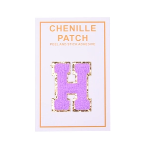 Detail of purple chenille letter H patch with gold sequins and peel and stick backing