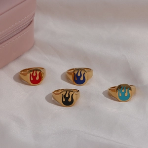 Set of four 18K gold plated stainless steel rings with colorful enamel flame patterns