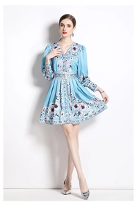 Close-up of vintage floral V-neck dress with long sleeves and a matching waist tie belt