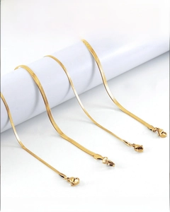 Detail view of 18K gold plated stainless steel flat snake chains with lobster clasps