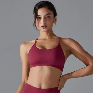 Detail of burgundy seamless ribbed waistband on high-elasticity yoga sports bra