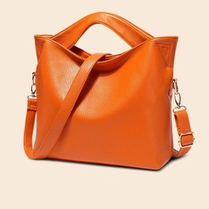 Orange lychee pattern leather tote bag with gold hardware and removable shoulder strap