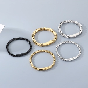 Detail of Byzantine style stainless steel bracelets in gold, silver and black finishes