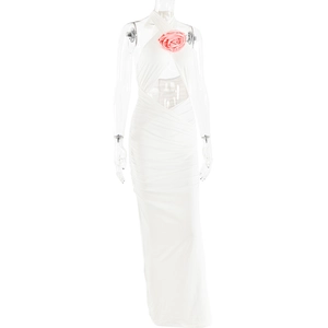 Detail of white halter neck dress featuring 3D pink flower and stylish cutout design