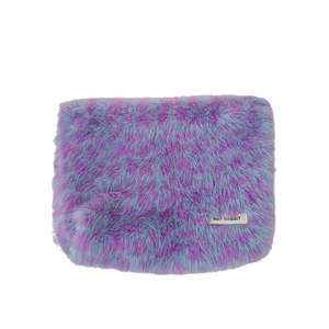 Plush leopard print cosmetic bag in purple and blue faux fur with logo label