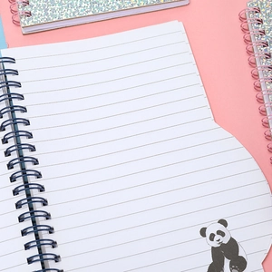 Spiral bound notebook with panda illustrations and lined pages on pink background