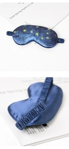 Macro detail of silk sleep mask featuring Van Gogh's Starry Night with elastic strap