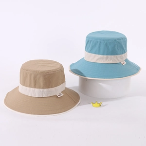Close-up of kids bucket hats with stitched K label and reinforced brim details