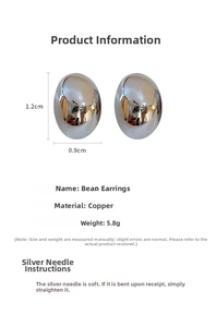 Detail view of oval metallic stud earrings with dimensions 1.2cm by 0.9cm on white background