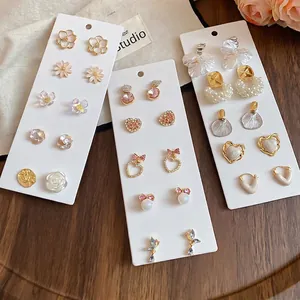 Elegant 10-piece set of gold-plated heart and pearl stud earrings for women with floral motifs