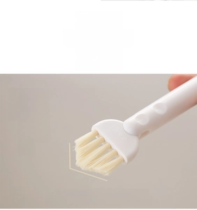 Macro detail of V-shaped bristles on dual-head cleaning brush for bottle lids and gaps