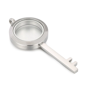 Silver stainless steel key-shaped locket pendant with circular glass frame
