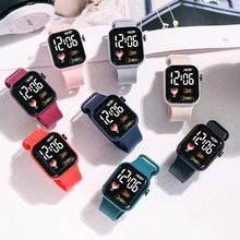 Flat lay of colorful waterproof LED digital watches with silicone straps for students