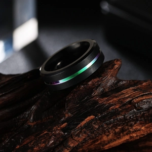 8mm black matte stainless steel ring with rainbow strip and brushed finish on wood base