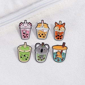 Enamel pins set featuring cute animals in bubble tea cups on canvas background