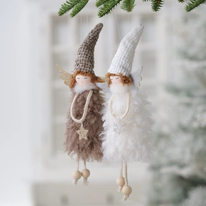 Charming plush angel Christmas tree ornaments in brown and white on pine branches