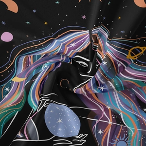 Detailed view of bohemian tapestry with mystic starry female print and smooth silk texture