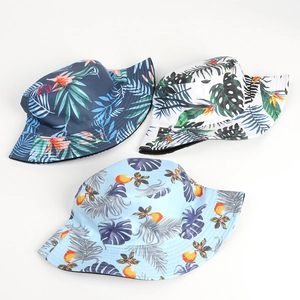 Three tie-dye tropical leaf print sun hats for women in various colorful summer patterns
