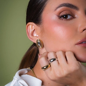 Two-tone 18k gold and silver oval earrings with matching stacked thick metal rings