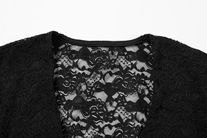 Detail of elegant black lace top featuring intricate floral patterns and V-neckline texture