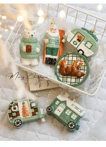 Detailed view of 6-piece ceramic Christmas ornaments in Morandi green and white theme