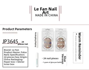 Detail of French press-on nails set with 3D bows, camellia flowers and pearl ribbon accents