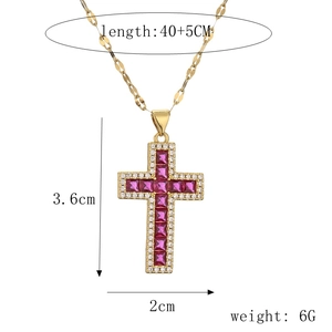 Macro view of gold chain and red gemstone cross pendant with detailed size measurements