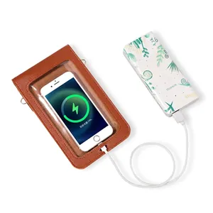 Brown leather touchscreen phone crossbody bag with transparent window and flip cover design