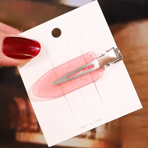 Detail of 6cm pink glitter acetate hair clip on white card showing its exact dimensions