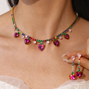 Luxury gold jewelry set with colorful rhinestones and pink heart tassel pendants