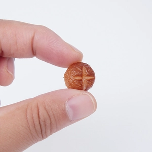 Miniature resin mushroom model for DIY crafts featuring realistic caramel baked texture