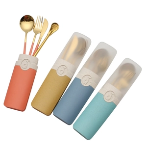 Portable stainless steel cutlery set with colorful storage cases and golden utensils