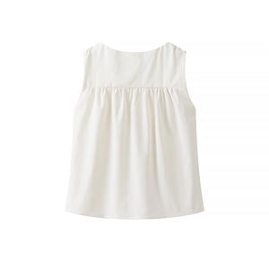Back view of a white sleeveless top with textured cotton linen fabric and natural pleats