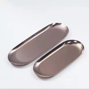 Set of two oval rose gold stainless steel metal trays in large and small sizes