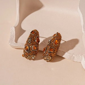 Retro bullet-shaped studs with amber rhinestones on gold alloy base with stones