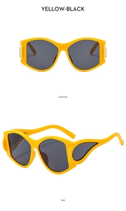 Close-up of Y2K sunglasses with yellow frame and sleek hollowed-out side temples