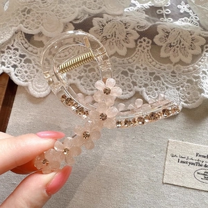 Elegant crystal flower hair claw clip with rhinestones for chic updo hair styling