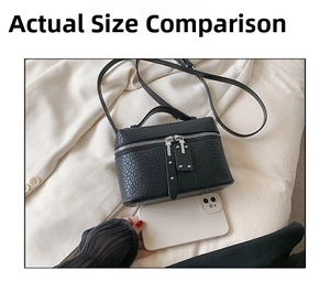 Mini black crossbody bag with embossed texture shown next to a phone for size scale