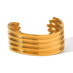 Macro shot of tiered 18K gold plated stainless steel cuff bracelet with mirror finish