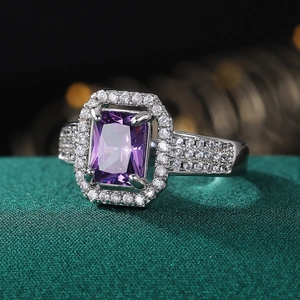Elegant silver ring with a large rectangular purple zircon and micro-paved crystal accents