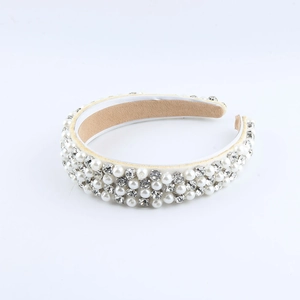 Baroque white satin headband featuring rows of luxury pearls and sparkling rhinestones