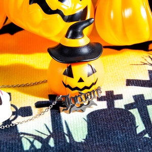 Detailed view of silver Halloween necklace with Jordan pendant and bat design