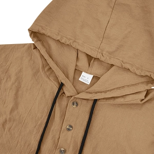 Close-up of linen hoodie collar and button detail with size L label texture