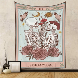 Detail of tarot lovers skull tapestry with vintage floral patterns on a beige wall