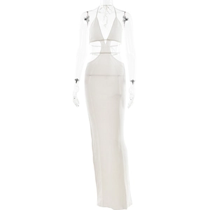 Detail of white knitted halter dress featuring intricate hollow-out patterns and texture