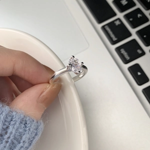Detailed close-up of a silver 925 ring with rectangular zircon in a four-prong setting