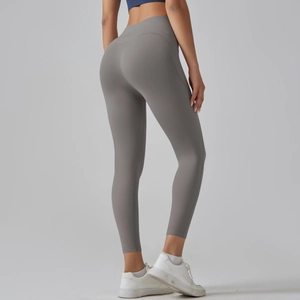 Rear view of high waisted grey seamless yoga leggings highlighting contour and fit