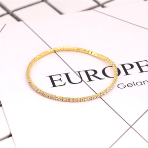 Detail of 2.0mm gold crystal bracelet with sparkling rhinestones on geometric grid