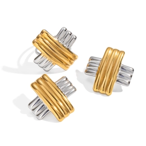 Minimalist gold and silver two-tone striped cross earrings and ring set on white background